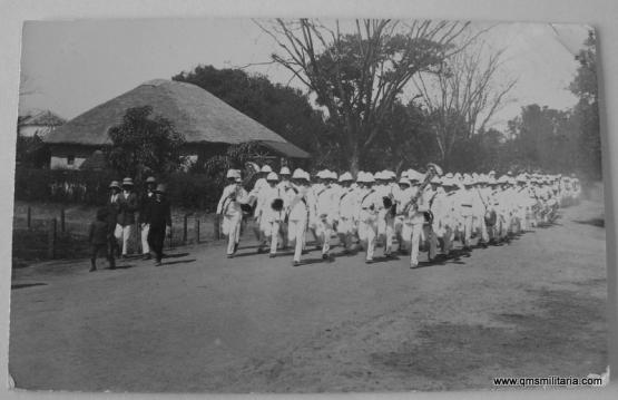 Post WW1 Real Postcard - York & Lancaster Regiment in tropical whites playing the Battalion from Church