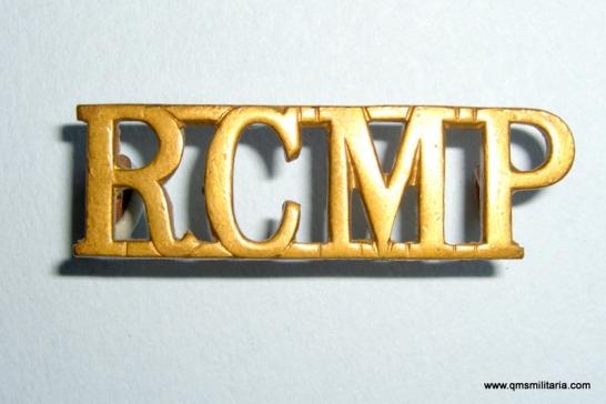 Royal Canadian Mounted Police ( RCMP ) Brass Shoulder Title - stamped Made in England