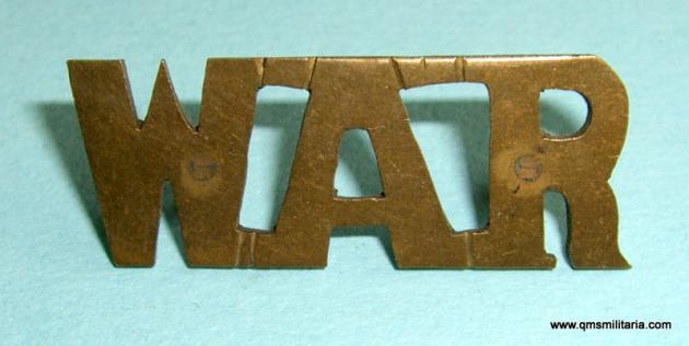 WAR - West African Regiment Theatre Made Brass Shoulder Title, pre 1928