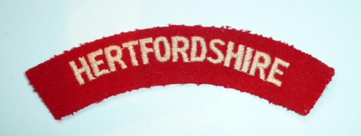 Hertfordshire Regiment (Territorial) Embroidered White on Red Felt Cloth Shoulder Title