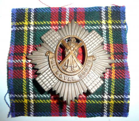The Royal Scots (Lothian Regiment) Other Ranks Bi-metal Cap Badge on Tartan Cloth Backing