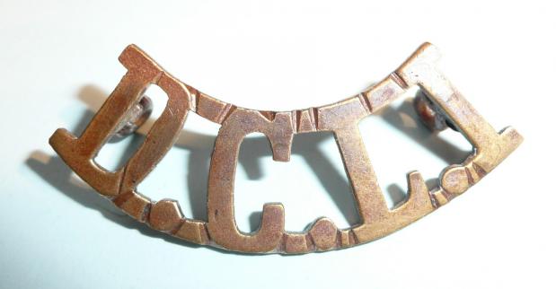 DCLI (Duke of Cornwalls Light Infantry) Curved Brass Metal Shoulder Title