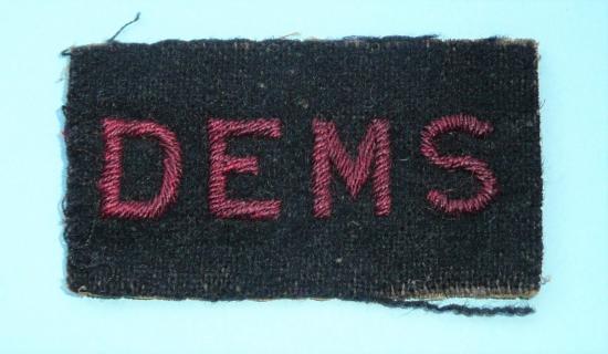 WW2 DEMS Embroidered Red on Black Cloth Sleeve Badge