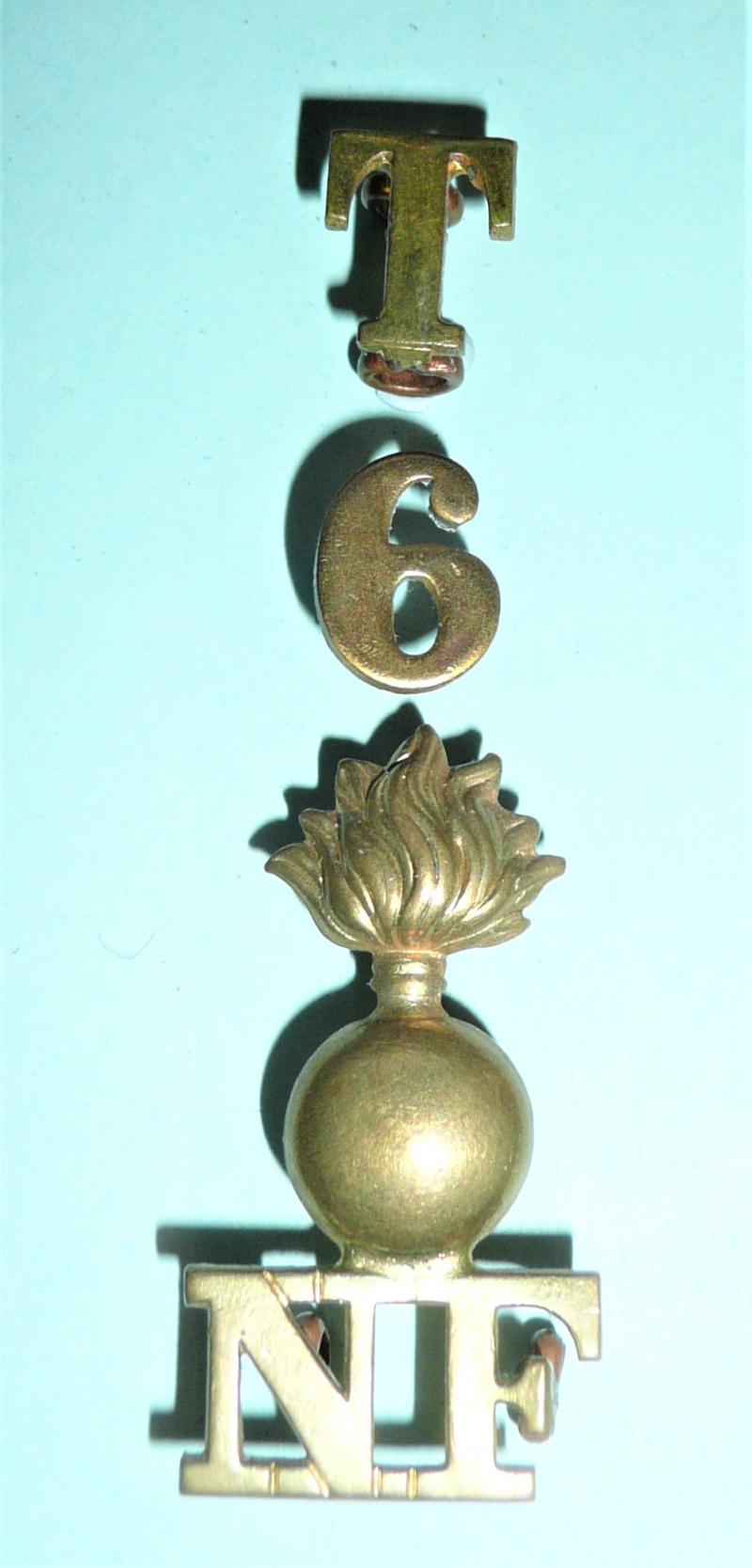 T / 6 / Grenade / NF (Northumberland Fusiliers) 4 Piece Brass Shoulder Title