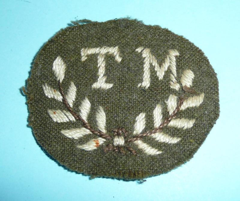 WW2 / Cold War  TM Tank Mechanic Unofficial Woven White on Khaki Proficiency Trade Arm Badge