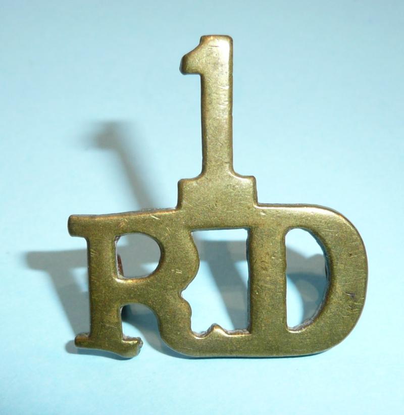 1 / RD 1st Royal Dragoons Early One Piece Brass Shoulder Title